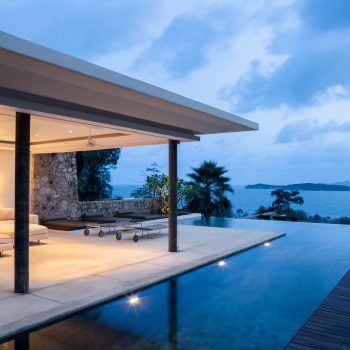Luxury Island Home With Infinity Pool At Dusk.